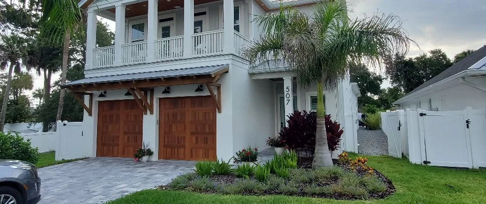 Plants in a landscape bed in front of a home in Florida.